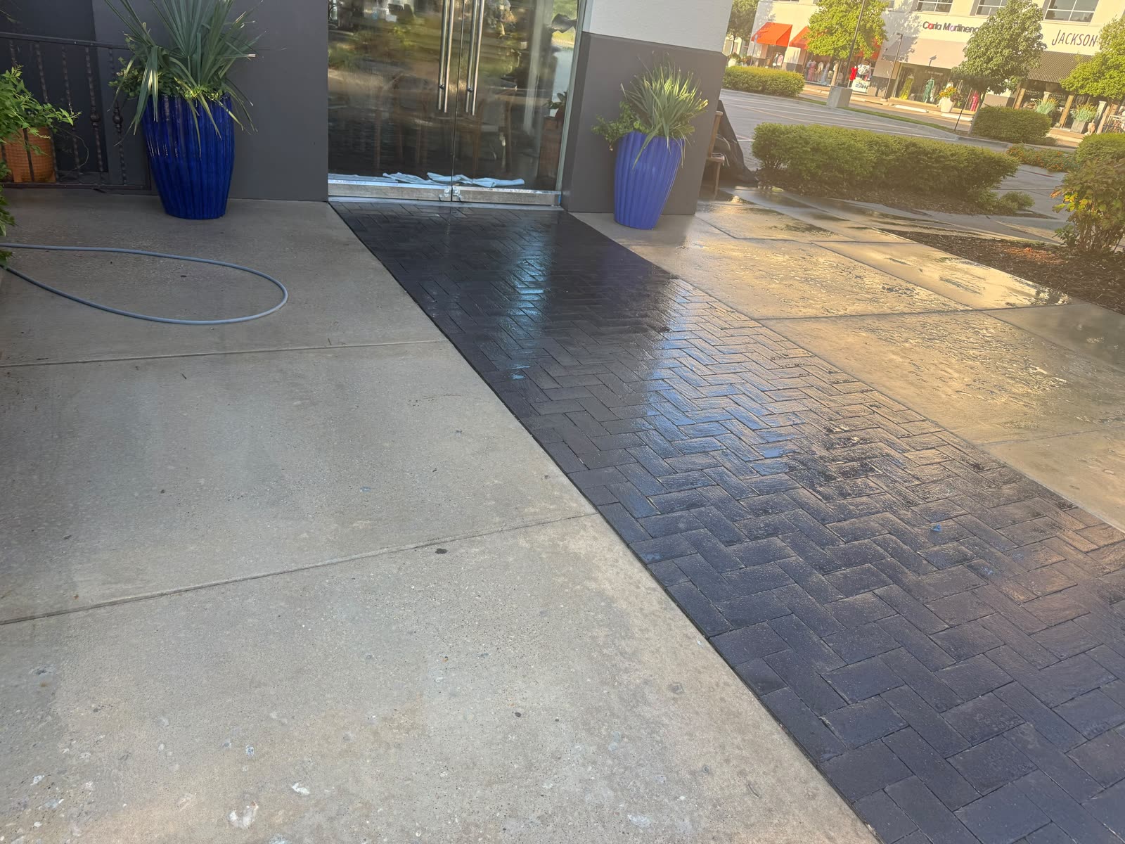 Commercial walkway half cleaned showing before and after in one frame