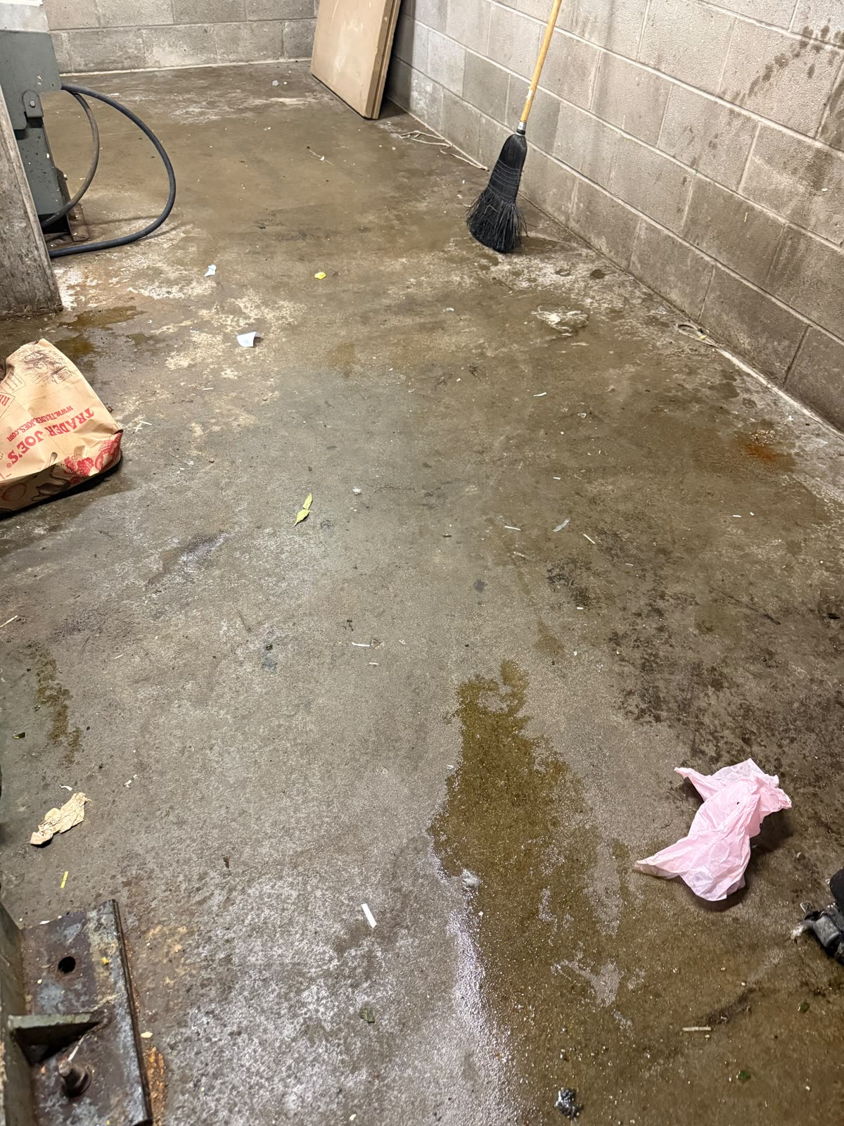 Back-of-house concrete floor stained before cleaning
