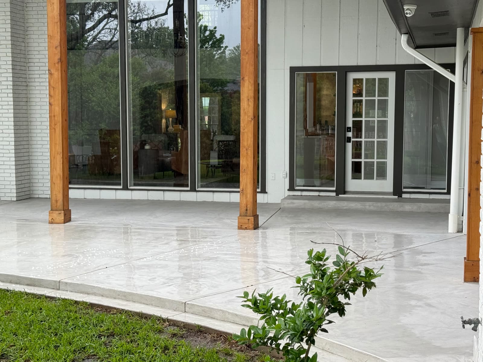Same covered patio concrete clean after pressure washing