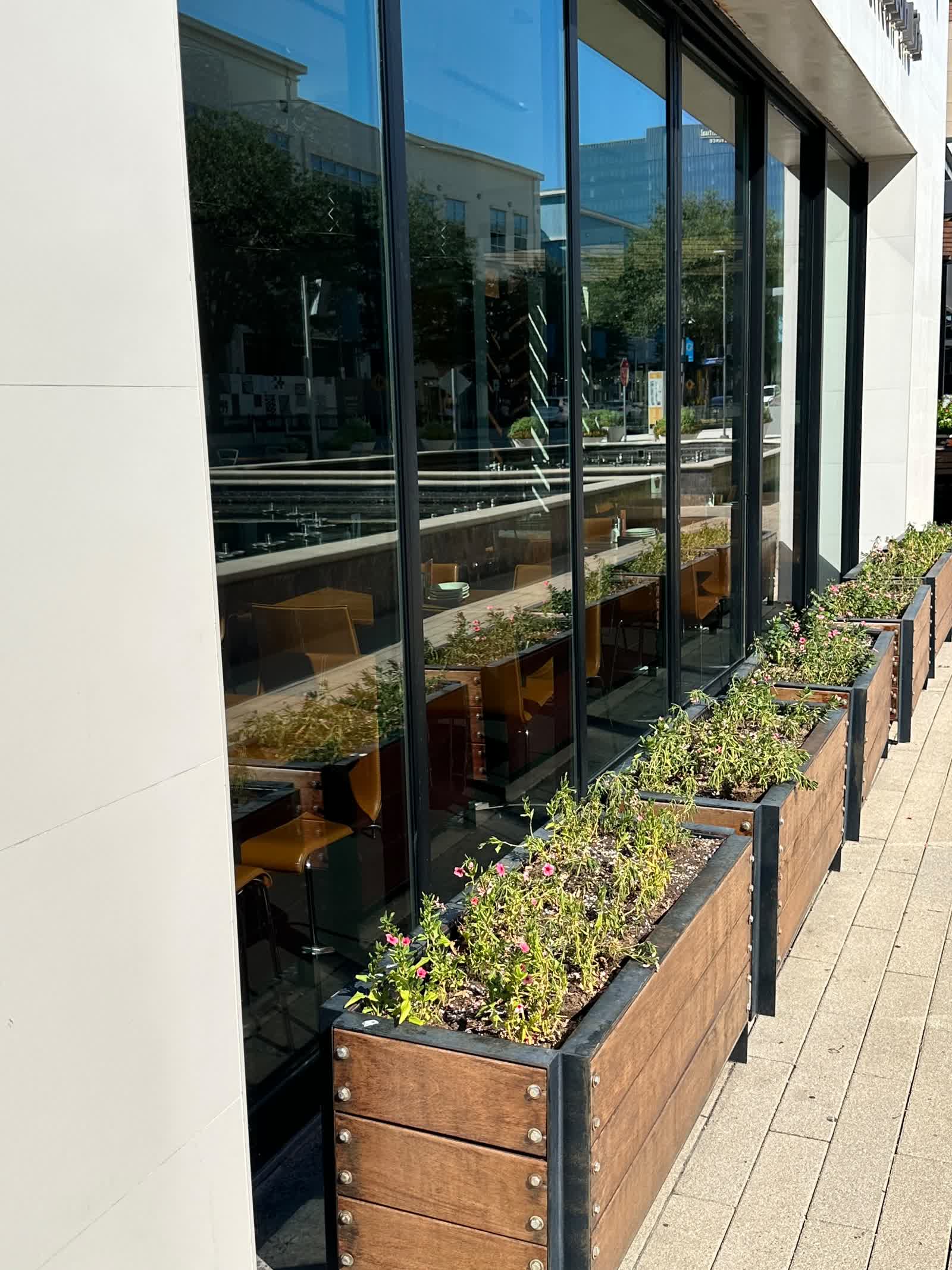 Commercial facade with clean glass and outdoor patio